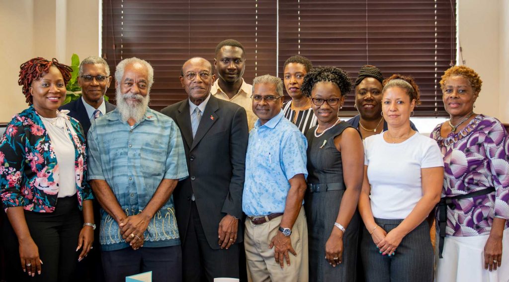 Photograph of the Minister of Health Hon Molwyn Joseph and Senior Staff from the Ministry of Health, Wellness and the Environment along with Executives of the Medical Benefits Scheme posing with the Health Economics Centre (HEU),  University of the West Indies Team on their arrival in November 2019. 